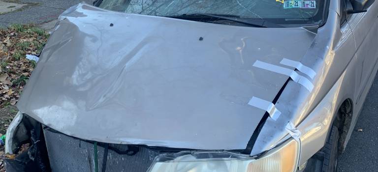 A badly damaged car fit to be sold to a junkyard